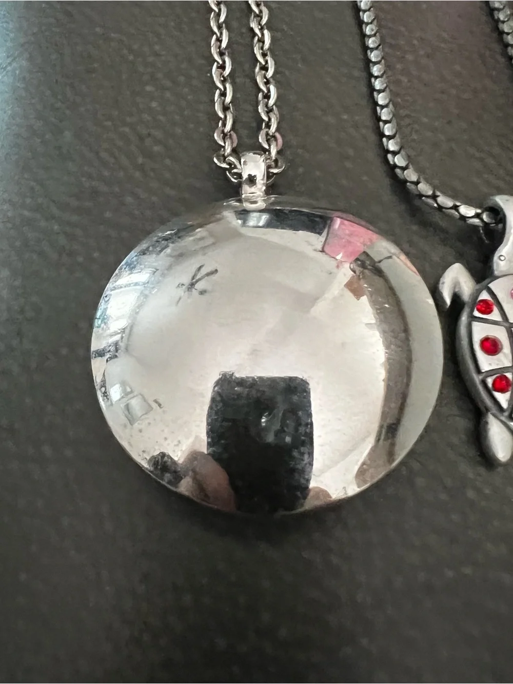 Silver tone Turtle Pendant Necklace with Red and Pink Accent Stones.